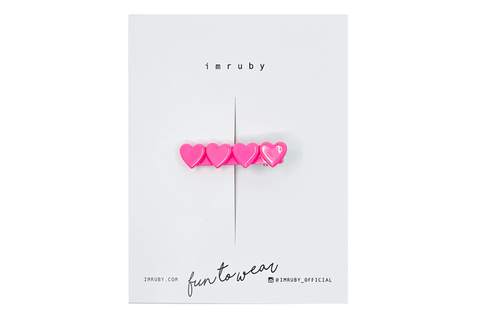 Hi! I'm BARBIE, a hot pink heart clip.

Hold back bangs, clip back hair, or simply use for stylistic purposes by adding some flair to your hair. Mix-and-match, and layer these hair clips or wear on their own for a soft, seasonal look.