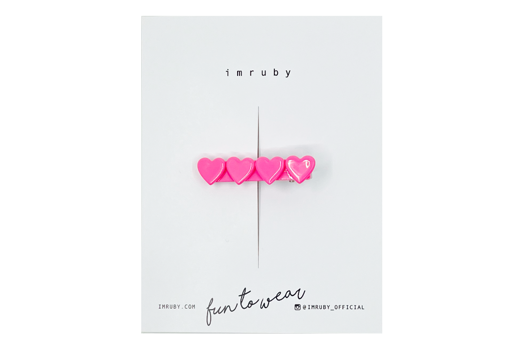 Hi! I'm BARBIE, a hot pink heart clip.

Hold back bangs, clip back hair, or simply use for stylistic purposes by adding some flair to your hair. Mix-and-match, and layer these hair clips or wear on their own for a soft, seasonal look.