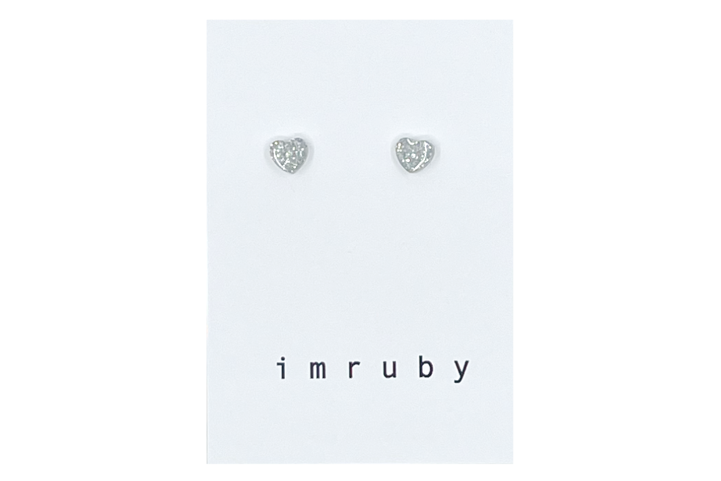 Hi! I'm BIBI, a silver glitter heart set of 2 stud earrings.

If you are looking for a perfect everyday staple, stud earrings may be exactly what you need! They are very tiny and so cute! These earring sets are perfect for numerous piercings or just to mix and match! 

Packed in a reusable bag to keep your jewelry shiny and clean.