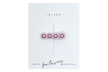 Load image into Gallery viewer, Hi! I&#39;m ELLE, a&nbsp;soft pink smiley clip.

Hold back bangs, clip back hair, or simply use for stylistic purposes by adding some flair to your hair. Mix-and-match, and layer these hair clips or wear on their own for a soft,&nbsp;seasonal look.