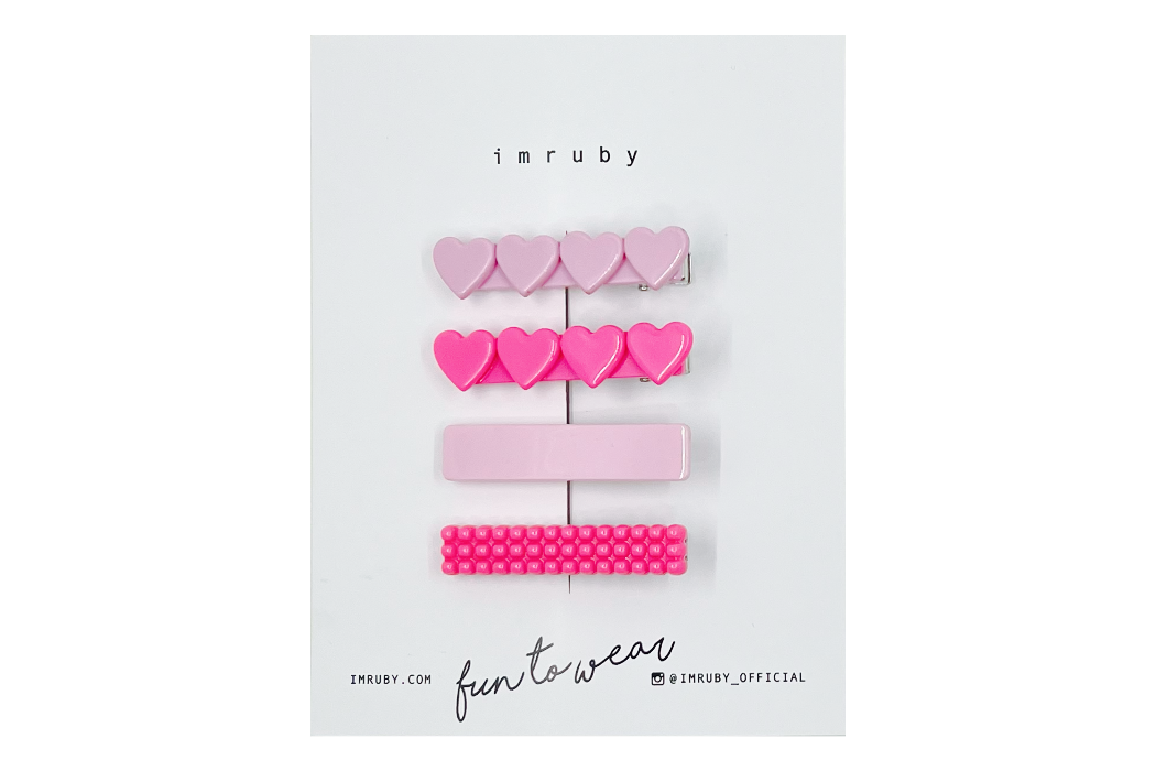 Hi! I'm a SET of 4 girly pink clips.

(1 x Elle heart, 1 x Barbie heart, 1 x Elle bar, 1 x Barbie bubble bar)

Hold back bangs, clip back hair, or simply use for stylistic purposes by adding some flair to your hair. Mix-and-match, and layer these hair clips or wear on their own for a soft, seasonal look.