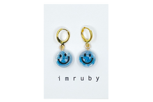 Load image into Gallery viewer, Hi! I&#39;m IZZY, a hippie blue smiley set of 2 drop earrings.

Add a touch of glam to your style with a pair of cute drop earrings! These earring&nbsp;sets are perfect for numerous piercings or just to mix and match!&nbsp;

Packed&nbsp;in a reusable bag to keep your jewelry shiny and clean.